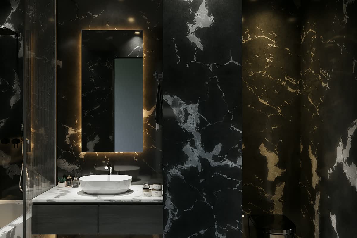 A black marble vanity with a backlit mirror